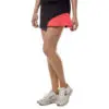 Woman playing padel tennis with a professional stance, holding a racket and ready to hit the ball