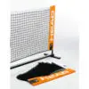 Two players engaged in a friendly game of padel, using a net and rackets.