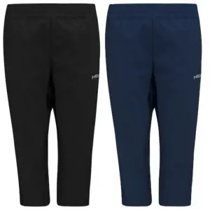 Woman playing padel tennis with a blue tennis racket in an indoor court