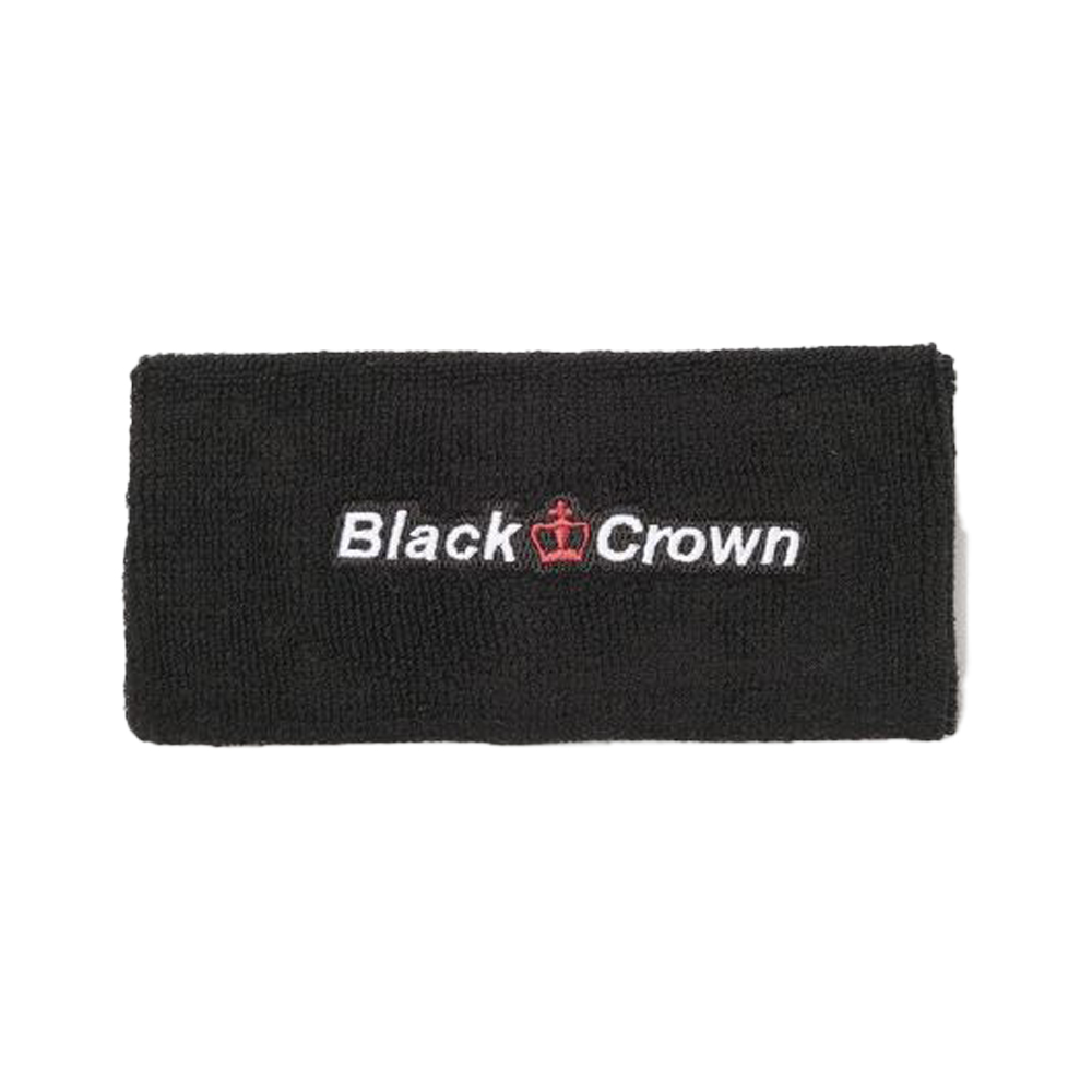 Two young people playing padel tennis on a sunny day.